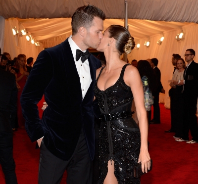 Tom Brady and Gisele Bundchen kiss at the ‘Schiaparelli And Prada: Impossible Conversations’ Costume Institute Gala at the Metropolitan Museum of Art in New York City on May 7, 2012