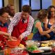 Billy Bush and Kit Hoover join contestants from TV One’s ‘My Momma Throws Down’ for a cook-off on the set on June 5, 2012