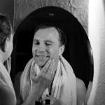 A man shown shaving