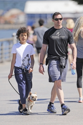 Hugh Jackman and son Oscar take their dog, Peaches, on a walk along the Hudson River Parkway in New York City on June 16, 2012