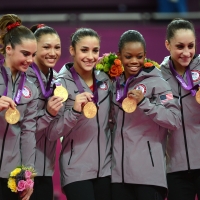 Gold medalist Team US Mckayla Maroney, Kyla Ross, Alexandra Raisman, Gabrielle Douglas and Jordyn Wieber celebrate  at the 02 North Greenwich Arena in London on July 31, 2012