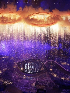 Rings representing both the Olympics and the Industrial Revolution are lit and lifted during the Opening Ceremony of the London 2012 Olympic Games at the Olympic Stadium in London on July 27, 2012 