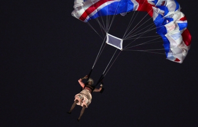An actor dressed to resemble Britain’s Queen Elizabeth II parachutes into the stadium during the opening ceremony of the London 2012 Olympic Games at the Olympic Stadium in London on July 27, 2012