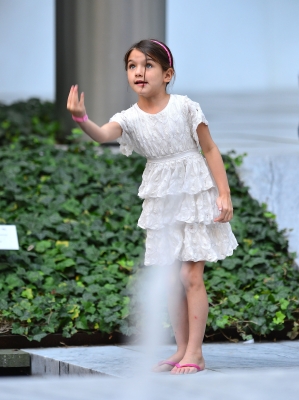 Suri Cruise plays at the Museum of Modern Art in NYC, August 6, 2012