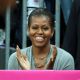 First Lady Michelle Obama watches the Men’s Basketball game between the U.S. and France at the London 2012 Olympic Games in London on July 29, 2012