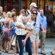 A smiling Katie Holmes and Suri Cruise leave the Museum of Modern Art in New York City, August 6, 2012