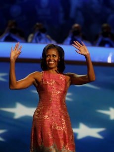 First Lady Michelle Obama waves before speaking at the Democratic National Convention (DNC) in Charlotte, North Carolina, U.S., Sept. 4, 2012