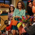 Billy Bush and Kit Hoover pose with some of the kids and the parents who took part in the Access Hollywood Live Halloween kids costume show