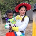 Sandra Bullock takes on ‘Toy Story’ as cowgirl Jessie, and totes around her own Buzz Lightyear son Louis, as they celebrate Halloween in Los Angeles on October 31, 2012