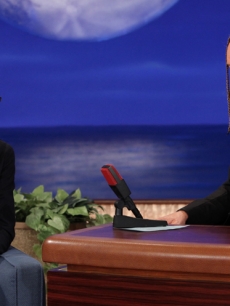 Guest Simon Baker of ‘The Mentalist’ marvels at Conan O’Brien’s cornrows and spray tan on ‘Conan,’ Oct. 25, 2012