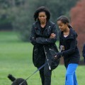 Michelle and Malia Obama are seen at the White House with Bo, their new Portuguese water dog, on April 14, 2009