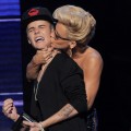 Kiss attack! Justin Bieber accepts the award for Favorite Pop/Rock Album from Jenny McCarthy onstage during the 40th American Music Awards held at Nokia Theatre L.A. Live in Los Angeles on November 18, 2012
