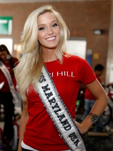 Miss Maryland Allyn Rose builds bikes for children of the troops at Pier 88, New York City, on May 26, 2011