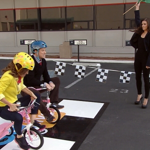 Billy Bush & Kit Hoover Race Tricycles With Danica Patrick Officiating!
