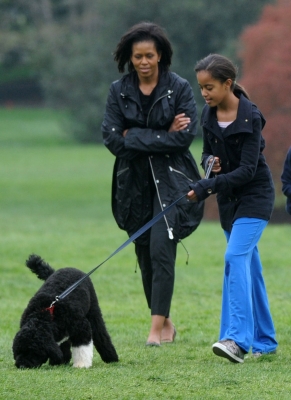 Michelle and Malia Obama are seen at the White House with Bo, their new Portuguese water dog, on April 14, 2009