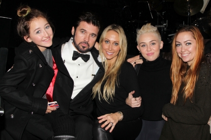 Billy Ray Cyrus poses with his family backstage at the hit musical ‘Chicago’ on Broadway at The Ambassador Theater in New York City on November 18, 2012