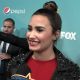 Demi Lovato chats with Access about expressing herself with her new darker hair color at “The X Factor” Finalists Party. Also, she talks about holding her own against Simon Cowell on the FOX reality series.