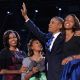 President Barack Obama, First Lady Michelle and daughters Sasha and Malia wave to supporters on election night in Chicago on November 6, 2012