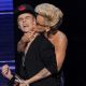 Kiss attack! Justin Bieber accepts the award for Favorite Pop/Rock Album from Jenny McCarthy onstage during the 40th American Music Awards held at Nokia Theatre L.A. Live in Los Angeles on November 18, 2012
