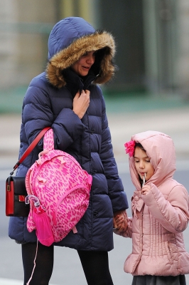 Katie Holmes and daughter Suri Cruise bundle up in big puffy winder coats as they head home from school in New York City on December 11, 2012 