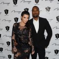 A pregnant Kim Kardashian hits the red carpet with Kanye West for a New Year’s Eve bash at 1 OAK Nightclub at the Mirage on December 31, 2012 in Las Vegas