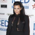 Hot mama-to-be! Kim Kardashian steps out in a revealing black ensemble to host ICED at Cowboys Dance Hall in Calgary, Canada on January 4, 2013 