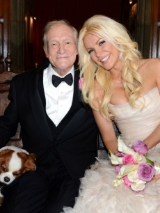 Hugh Hefner and Crystal Harris pose for photos following their wedding at the Playboy Mansion on December 31, 2012