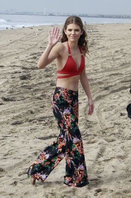 AnnaLynne McCord gives a wave as she hits the beach while filming ‘90210’ in Los Angeles on December 17, 2012