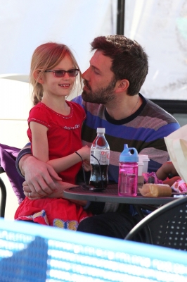 Awww! Ben Affleck leans in to give daughter Violet a kiss on the cheek at an ice rink in Santa Monica, Calif., on January 4, 2013