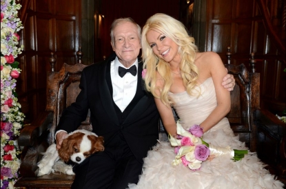 Hugh Hefner and Crystal Harris pose for photos following their wedding at the Playboy Mansion on December 31, 2012