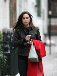 Kate Middleton, gf of Britain's Prince William, walks in London