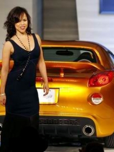 Rosie Perez walks the runway with a Pontiac convertible