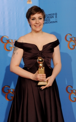 ‘Girls’ star Lena Dunham poses with Best Actress in a TV Comedy Award in the press room during the 70th Annual Golden Globe Awards