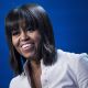 First Lady Michelle Obama smile while speaking during the Kids’ Inaugural concert at the Washington Convention Center January 19, 2013 in Washington, DC