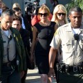 Lindsay Lohan her lawyer Mark Heller and her mother Dina leave Airport Courthouse after the pre-trial hearing on January 30, 2013 in Los Angeles
