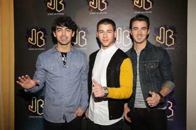 Joe Jonas, Nick Jonas and Kevin Jonas of the Jonas Brothers attend a press conference at W Hotel Mexico City on January 23, 2013 in Mexico City
