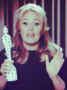 Adele accepts her Best British Single Award via satellite at The Brit Awards 2013 at The O2 Arena on February 20, 2013