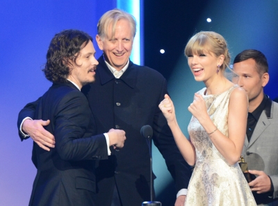 Musician John Paul White, producer T Bone Burnett, and Taylor Swift accept an award onstage during the 55th Annual Grammy Awards at Nokia Theatre L.A. Live, Los Angeles, on February 10, 2013
