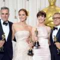 Daniel Day-Lewis, winner of the Best Actor award for ‘Lincoln;’ Jennifer Lawrence, winner of the Best Actress award for ‘Silver Linings Playbook;’ Anne Hathaway, winner of the Best Supporting Actress award for ‘Les Miserables;’ and Christoph Waltz, winner of the Best Supporting Actor award for ‘Django Unchained,’ pose in the press room during the Oscars held at Loews Hollywood Hotel on February 24, 2013