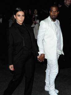 Kim Kardashian and Kanye West are spotted holding hands at the Givenchy Fall/Winter 2013 Ready-to-Wear show in Paris on March 3, 2013