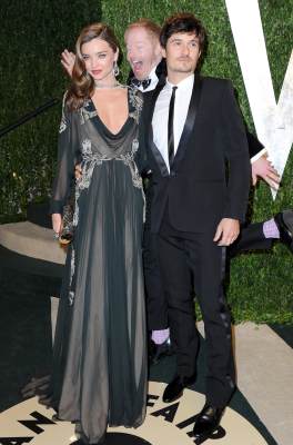 Miranda Kerr and Orlando Bloom get photo-bombed by ‘Modern Family’s Jesse Tyler Ferguson at the 2013 Vanity Fair Oscar Party at Sunset Tower on February 24, 2013 in West Hollywood, Calif.