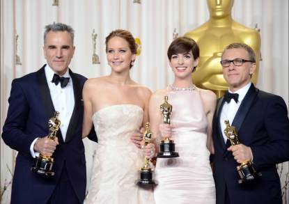 Daniel Day-Lewis, winner of the Best Actor award for ‘Lincoln;’ Jennifer Lawrence, winner of the Best Actress award for ‘Silver Linings Playbook;’ Anne Hathaway, winner of the Best Supporting Actress award for ‘Les Miserables;’ and Christoph Waltz, winner of the Best Supporting Actor award for ‘Django Unchained,’ pose in the press room during the Oscars held at Loews Hollywood Hotel on February 24, 2013