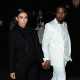Kim Kardashian and Kanye West are spotted holding hands at the Givenchy Fall/Winter 2013 Ready-to-Wear show in Paris on March 3, 2013
