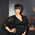 Kim Kardashian cradles her baby bump at the ‘Tyler Perry’s Temptation: Confessions Of A Marriage Counselor’ Atlanta Screening at AMC Parkway Pointe on March 16, 2013 in Atlanta, Georgia