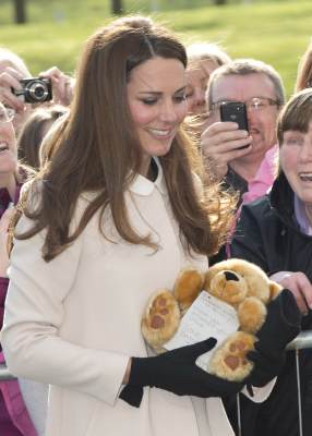 Catherine, Duchess of Cambridge receives a teddy bear as she visits the offices of Child Bereavement UK on March 19, 2013 in Saunderton, Buckinghamshire