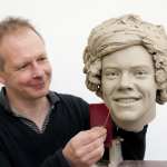 Madame Tussauds, sculptor Jim Kemp works on the clay head of Harry Styles of One Direction. Madame Tussauds announced on March 11, 2013 that the world famous wax attraction will immortalize the band by creating five individual wax figures of each member