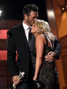 Blake Shelton (L) and Miranda Lambert accept the Song of the Year award onstage during the 48th Annual Academy of Country Music Awards at the MGM Grand Garden Arena on April 7, 2013