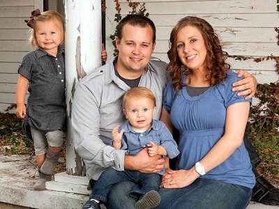 Josh and Anna Duggar with their kids, Mackynzie (left) and Michael
