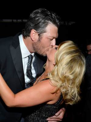 Blake Shelton and Miranda Lambert share a kiss at the 48th Annual Academy of Country Music Awards at the MGM Grand Garden Arena on April 7, 2013 in Las Vegas