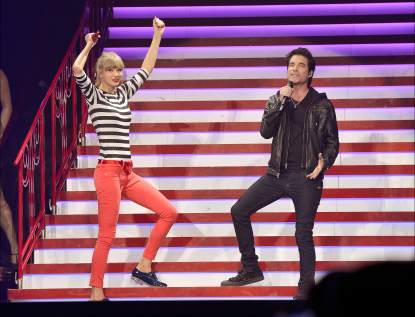 Taylor Swift and Pat Monahan perform onstage at the Prudential Center on March 29, 2013 in Newark, New Jersey